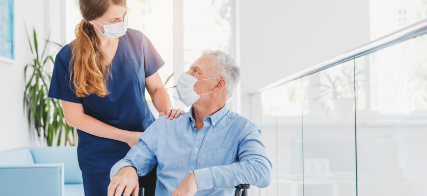 A doctor discusses medication management with a senior in a NY assisted living home.