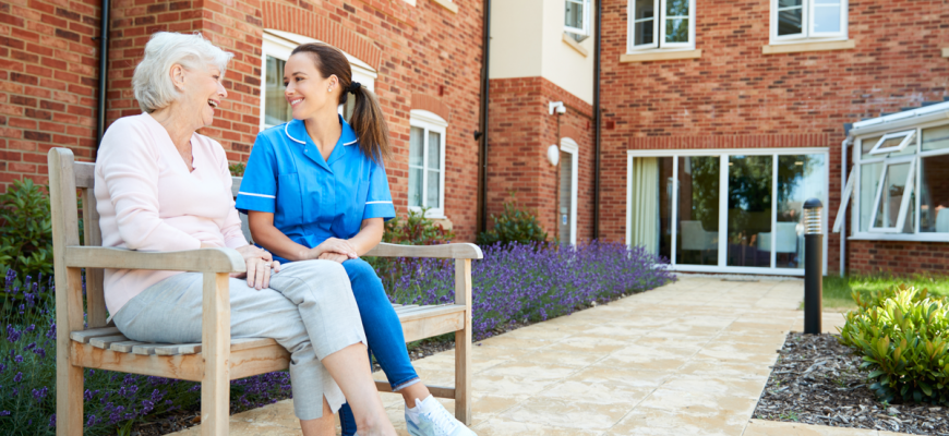 A caregiver and senior in a New York assisted living facility.