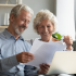 Senior couple signing up for Medicare
