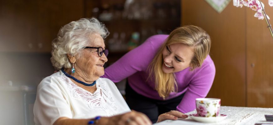 Women talking to Elderly lady